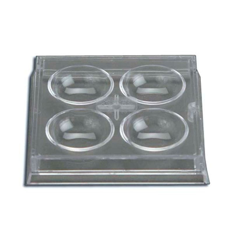 Clear plastic slide with four circular compartments on a white background