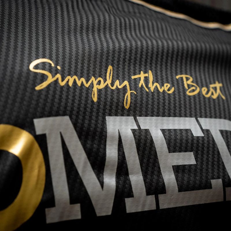 Text 'Simply the Best' on a textured surface with a logo in the corner.