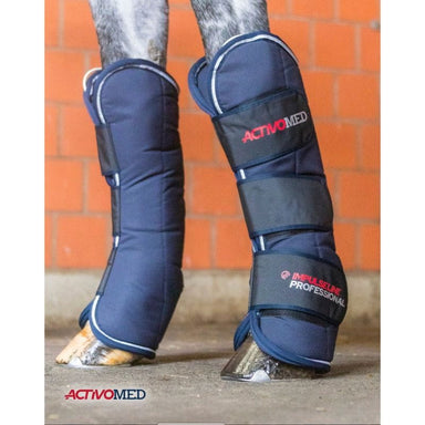 Navy protective leg wraps on a horse's legs with 'ActivoMed' branding against an orange brick wall.