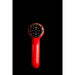 Red handheld device with circular black component on a black background