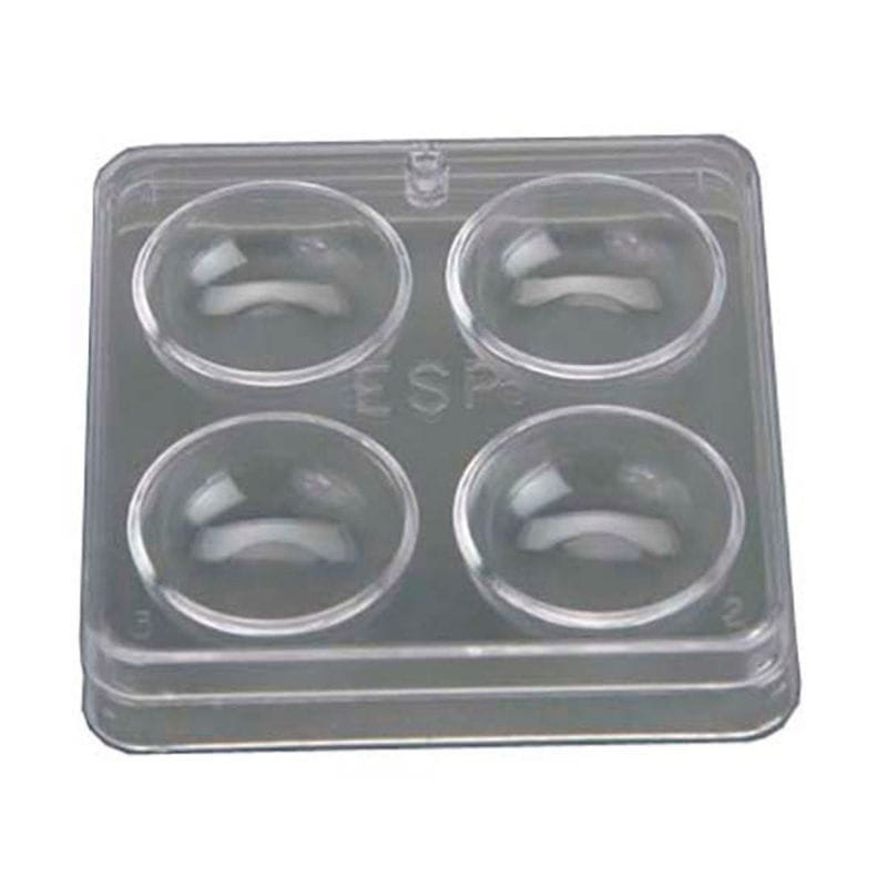 Clear plastic mold with four circular cavities on a white background
