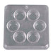 Clear plastic mold with six circular cavities on a white background