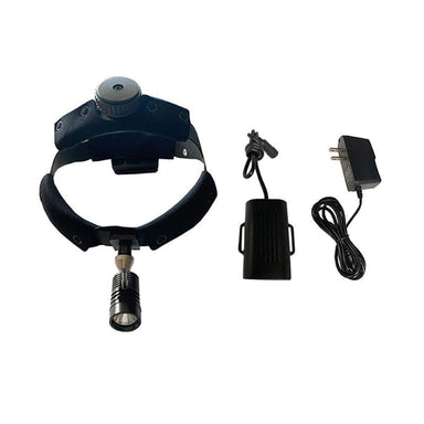 A black headlamp with an adjustable padded headband and a mounted cylindrical light, shown alongside a black cylindrical accessory, a black power adapter with cord, and a small black clip on a plain white background.