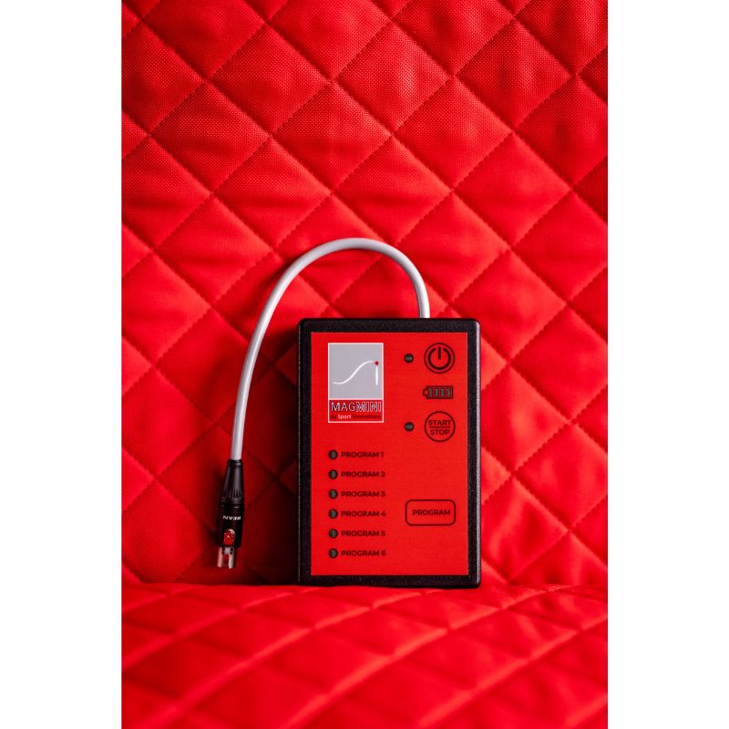 Red electronic device with a cable on a red quilted background