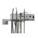 A dental operatory wall unit with multiple handpieces and gray tubing, mounted on a white wall. The control box has the Novacent logo on the front right.