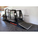 Black horse treadmill with lift with 'Q-Line' branding in a garage setting