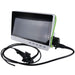 Endoscopic camera monitor system with a white and black screen unit, green side trim, attached black cables, and a black probe on a white background.