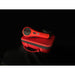 Red handheld 3b laser with a black handle on a matching red case against a black background
