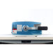 Blue and silver machine with a black handle on a white background