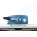 Blue and white appliance with a handle on a white background