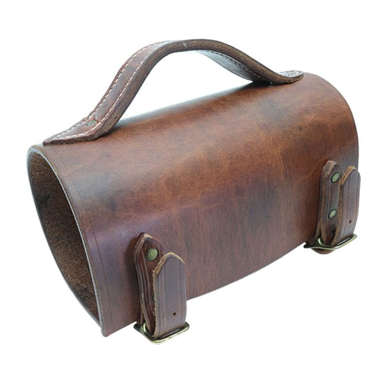 Brown leather bag with handle and strap on a white background