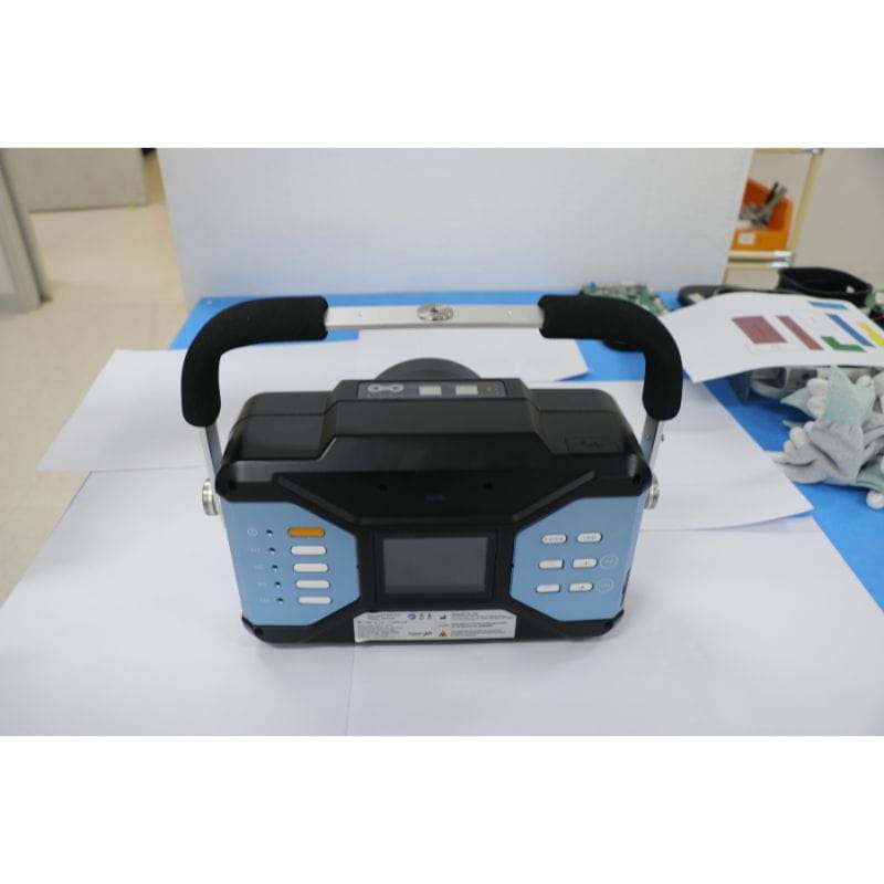 Portable electronic device with a handle on a table