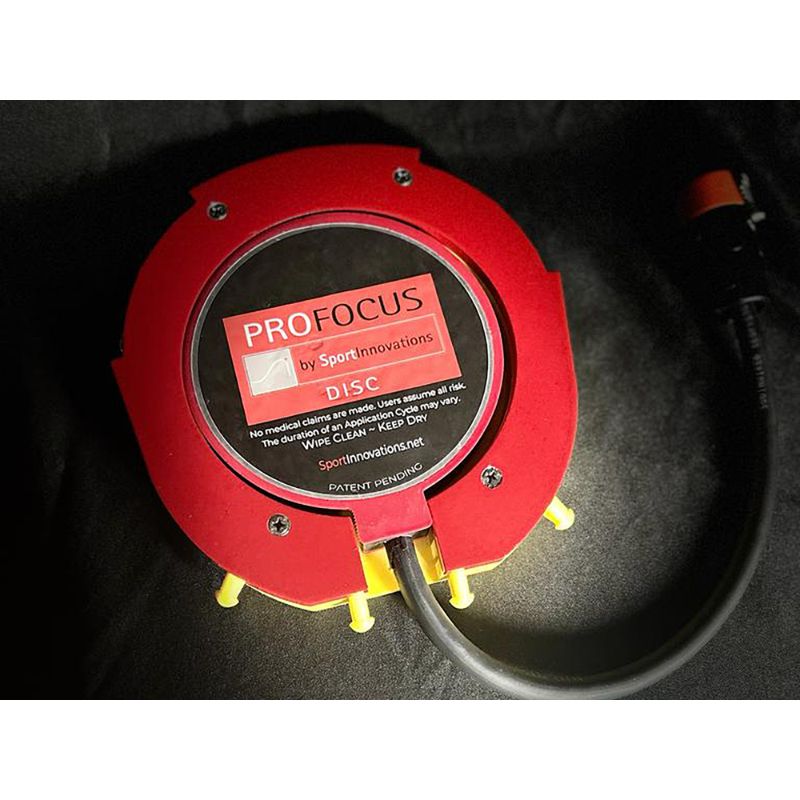 Red Pro Focus disc golf target on a black background