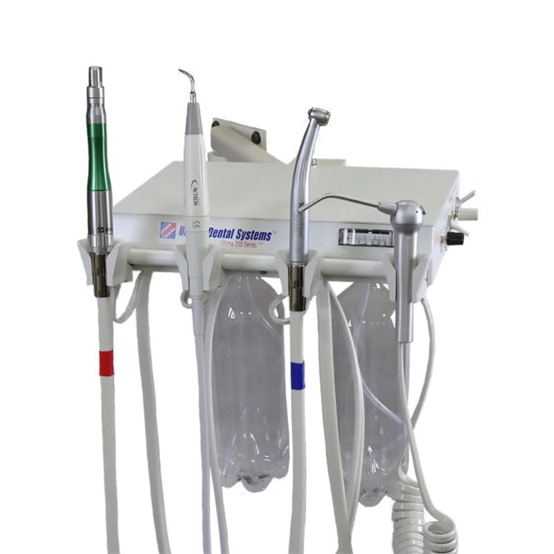 A white dental operatory wall unit with multiple handpieces, tubing, and clear air/water reservoirs on a plain white background.